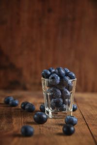 Preview wallpaper blueberry, berry, glass, wooden, surface