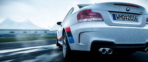 Preview wallpaper bmw 1-series m coupe, bmw, car, white, wet, rear view, speed