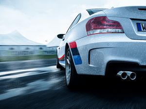 Preview wallpaper bmw 1-series m coupe, bmw, car, white, wet, rear view, speed