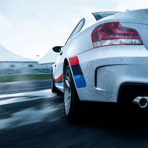 Preview wallpaper bmw 1-series m coupe, bmw, car, white, wet, rear view, speed