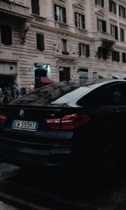 Preview wallpaper bmw, black, rear view, city