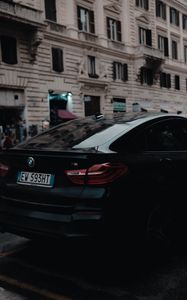 Preview wallpaper bmw, black, rear view, city