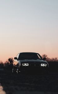 Preview wallpaper bmw, car, black, headlights, light, twilight