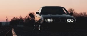 Preview wallpaper bmw, car, black, headlights, light, twilight