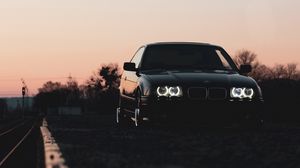 Preview wallpaper bmw, car, black, headlights, light, twilight