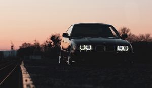 Preview wallpaper bmw, car, black, headlights, light, twilight