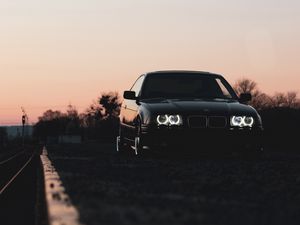 Preview wallpaper bmw, car, black, headlights, light, twilight