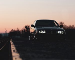 Preview wallpaper bmw, car, black, headlights, light, twilight