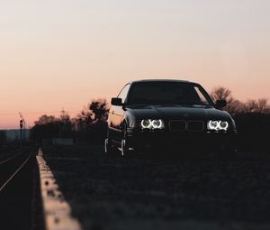 Preview wallpaper bmw, car, black, headlights, light, twilight