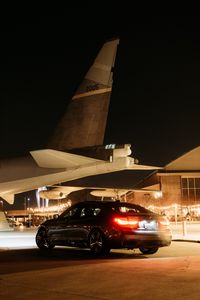 Preview wallpaper bmw, car, black, tailights, light, airplane