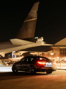 Preview wallpaper bmw, car, black, tailights, light, airplane