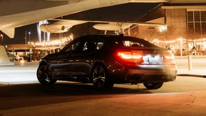 Preview wallpaper bmw, car, black, tailights, light, airplane