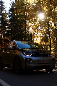 Preview wallpaper bmw, car, front view, motion, autumn, trees
