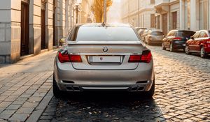 Preview wallpaper bmw, car, gray, rear view, street