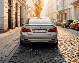 Preview wallpaper bmw, car, gray, rear view, street