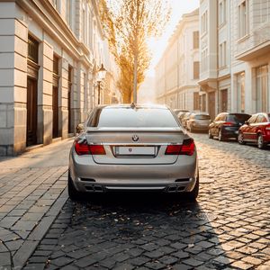 Preview wallpaper bmw, car, gray, rear view, street