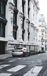 Preview wallpaper bmw, car, gray, parking, road, buildings