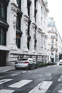 Preview wallpaper bmw, car, gray, parking, road, buildings