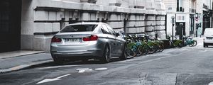 Preview wallpaper bmw, car, gray, parking, road, buildings