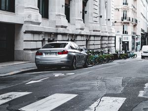 Preview wallpaper bmw, car, gray, parking, road, buildings