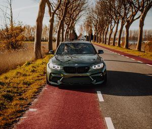 Preview wallpaper bmw, car, green, trees, road