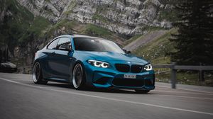 Preview wallpaper bmw, car, side view, road, rock