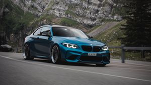 Preview wallpaper bmw, car, side view, road, rock