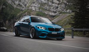 Preview wallpaper bmw, car, side view, road, rock