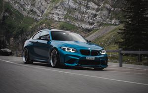 Preview wallpaper bmw, car, side view, road, rock