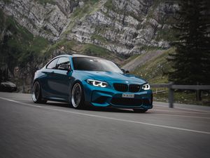 Preview wallpaper bmw, car, side view, road, rock