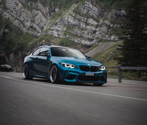 Preview wallpaper bmw, car, side view, road, rock