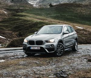 Preview wallpaper bmw, car, suv, mountains, rocks