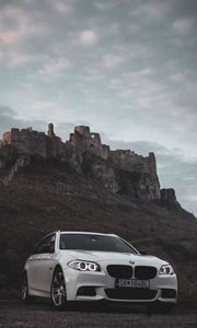 Preview wallpaper bmw, car, white, front view, rock, nature