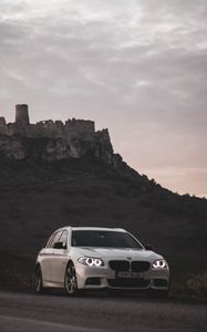 Preview wallpaper bmw, car, white, road, castle, ruins