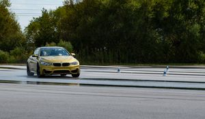 Preview wallpaper bmw, car, yellow, road