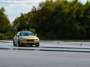 Preview wallpaper bmw, car, yellow, road
