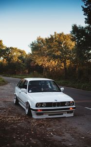 Preview wallpaper bmw, white, car, autumn, trees