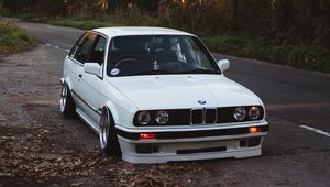 Preview wallpaper bmw, white, car, autumn, trees
