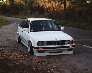 Preview wallpaper bmw, white, car, autumn, trees