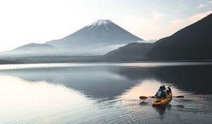 Preview wallpaper boat, canoe, volcano, sea, ripples