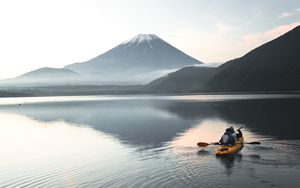 Preview wallpaper boat, canoe, volcano, sea, ripples