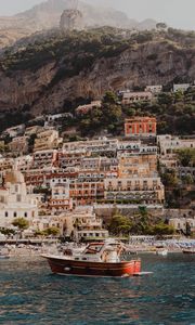 Preview wallpaper boat, city, buildings, coast, rocks, sea