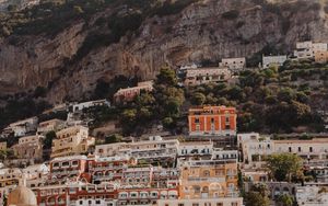 Preview wallpaper boat, city, buildings, coast, rocks, sea