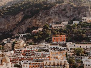 Preview wallpaper boat, city, buildings, coast, rocks, sea