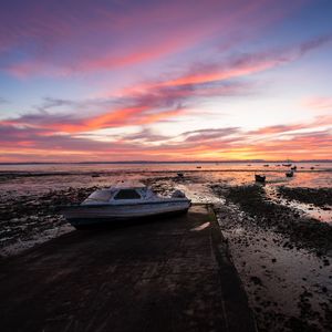 Preview wallpaper boat, coast, sea, sunrise