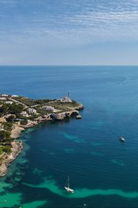 Preview wallpaper boat, island, sea, lighthouse, houses