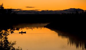 Preview wallpaper boat, lake, bushes, sunset, silhouette