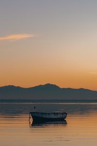 Preview wallpaper boat, lake, sunset, dusk, water