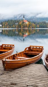 Preview wallpaper boat, lake, trees, buildings, reflection