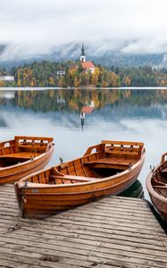 Preview wallpaper boat, lake, trees, buildings, reflection